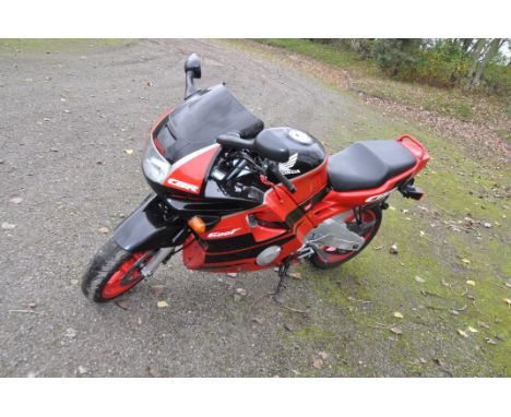 A 1991 HONDA CBR600F MOTORBIKE, 599cc petrol engine, first registered April 1991 under number plate H649 BKH, MOT expires 25t