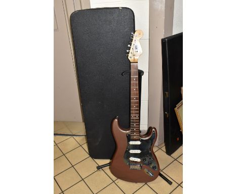 A COPY OF A FENDER STRATOCASTER GUITAR, metallic painted finish to the body with distressed metal pick guard, together with a