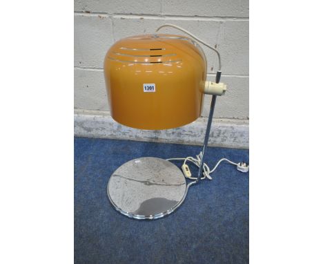 HARVEY GUZZINI, AN ITALIAN MID CENTURY TABLE LAMP, with a height adjustable copper coloured dome shade, raised on a chrome su