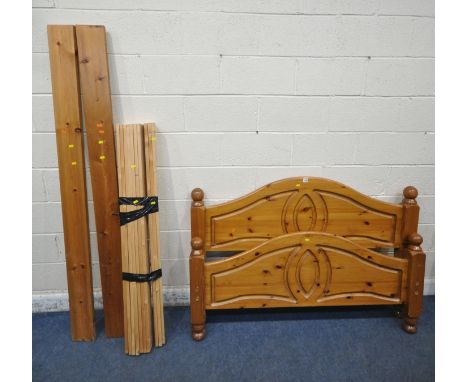 A MODERN PINE 4FT6 BEDSTEAD (condition report: general signs of wear and usage, side rails, slats, central support beam, and 