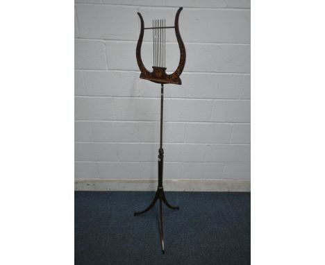 A GEORGIAN MAHOGANY TELESCOPIC SHEET MUSIC STAND, the tilting surface in the shape of a lyre, with marquetry inlay, the brass