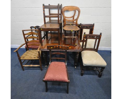 A VICTORIAN MAHOGANY WIND OUT DINING TABLE, with one additional leaf, raised on fluted and tapered legs, with brass caps and 