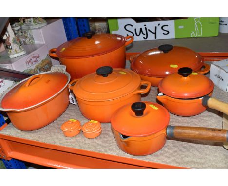 LE CREUSET CAST IRON SAUCEPANS/ CASSEROLE POTS AND CRUET SET, in orange enamel outer finish and cream enamel inside, with pou