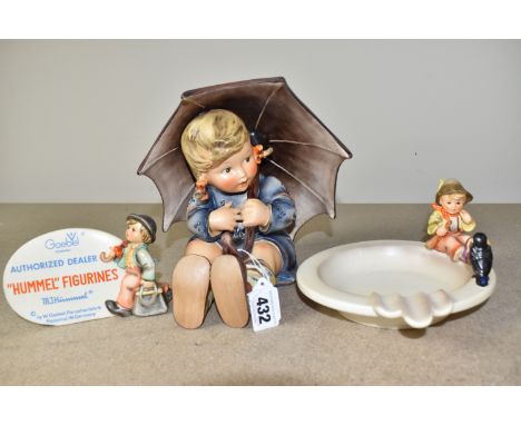 THREE GOEBEL HUMMEL ITEMS to include an 'authorised dealer plaque' No. 187, height 9cm, an ashtray with a seated boy and a cr