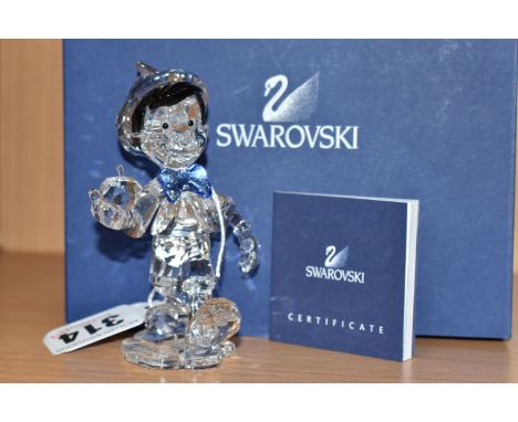 A BOXED SWAROVSKI CRYSTAL'PINOCCHIO' FIGURE, Walt Disney's 'Pinocchio' produced 2010, model no. 1016766, with certificate (1 