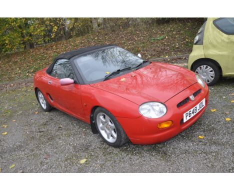 A 1997 MG F SPORT CONVERTIBLE CAR in red, with a 1796cc petrol engine, 5 speed manual gearbox, odometer reads 64,917 miles (u