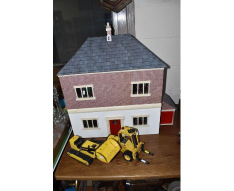 A DOLLS HOUSE AND TWO TONKA VEHICLES, comprising front opening dolls house, four rooms inside, the roof lifting up to reveal 