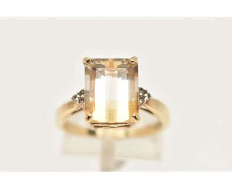 A 9CT GEM RING, designed as a rectangular gem, possibly tourmaline, with colourless gem detail to the shoulders, possibly top