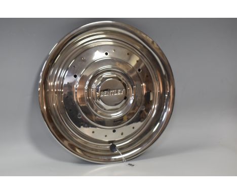 A BENTLEY HUB CAP, diameter 42cm (1) (Condition Report:  appears in good condition, some slight dents on the rim, scratches)