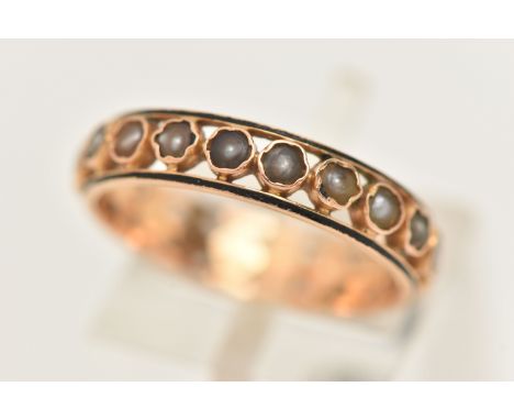 A YELLOW METAL SPLIT PEARL AND ENAMEL FULL ETERNITY RING, set with a row of worn split pearls, each collet set between black 