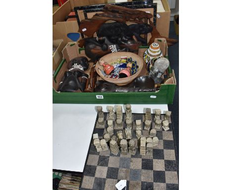 A BOX AND LOOSE INTERNATIONAL TOURIST ITEMS, to include a carved stone chess set (af, sd), a stone bust, two figural wall pla