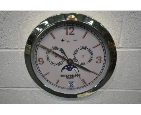 A PATEK PHILIPPE GENEVE DEALERS ADVERTISING WALL CLOCK, with a brassed frame, and a cream dial, diameter 40cm (condition repo