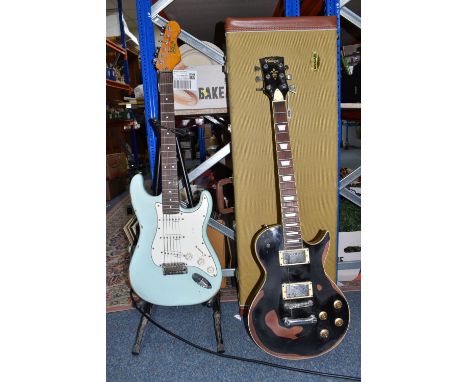 TWO 'VINTAGE' MARKED ELECTRIC GUITARS to include a black bodied electric guitar branded 'Vintage' to the headstock, and a tur