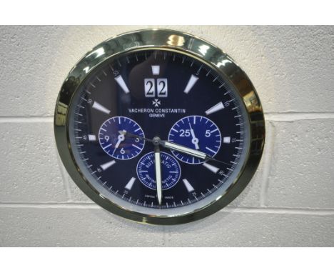 A VACHERON CONSTANTIN GENEVE DEALERS ADVERTISING WALL CLOCK, with a brassed frame, and a dark blue dial, diameter 40cm (condi