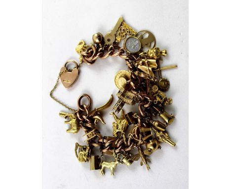 A 9ct gold link charm bracelet with numerous charms to include vintage racing cars, bagpipes, Westminster Abbey etc, approx 6