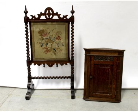 An Edwardian oak wall-hanging corner cupboard, floral carved frieze to single door, 65 x 46cm and a Victorian mahogany fire s