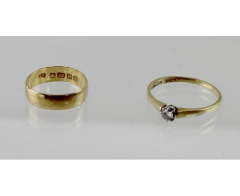 A 22ct yellow gold ladies' wedding band, size J, approx 2.5g and an 18ct yellow gold ladies' dress ring with small solitaire 