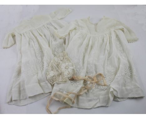 A small quantity of vintage textiles, two Edwardian embroidered Christening gowns and a crocheted baby bonnet.