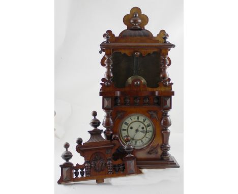A late 19th century mahogany Vienna-style wall clock by HAC (Hamburg American Clock Company), two-train movement striking on 