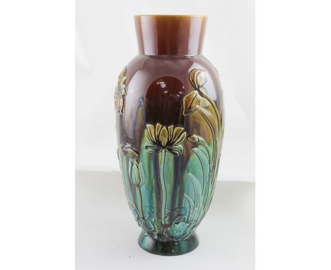 An Alex Burns for Linthorpe Pottery art pottery vase, relief decorated with floral designs on a Majolica glazed ground, impre