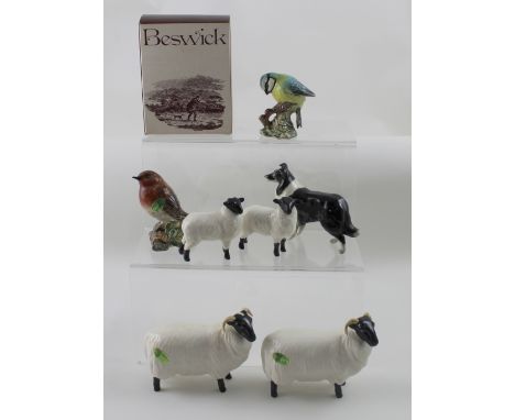 Seven Beswick figures comprising two rams, two lambs, a border collie, a blue tit and a robin (7). CONDITION REPORT no visibl