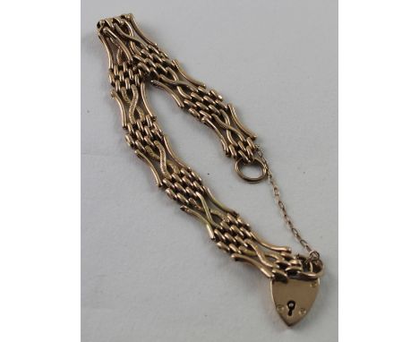 A 9ct yellow gold gate bracelet with padlock clasp, approx 14g.