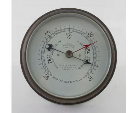 A brass-cased maritime barometer, marked 'H. Hughes &amp; Son, 59 Fenchurch Street London'.