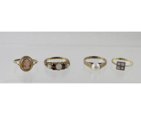 Four 9ct gold ladies' dress rings to include a ring with three opals and small garnets, a cameo ring, ring with single pearl 