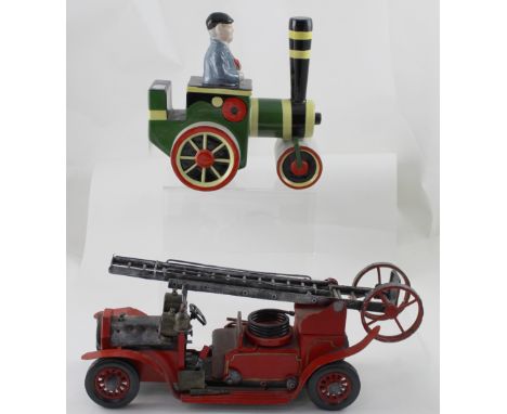 A Lorna Bailey signed limited edition model of Fred Dibnah in a traction engine, no 31/100, length 23.5cm and a tinplate mode