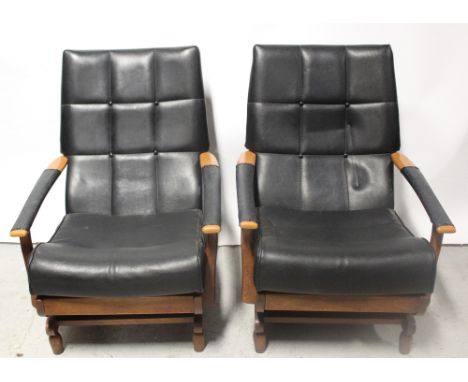 A pair of 1970s black leatherette and teak-framed rocking chairs with button-back upholstery (2).