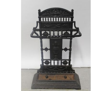 A Victorian cast iron stick/umbrella stand with twist front rail, height 85cm.