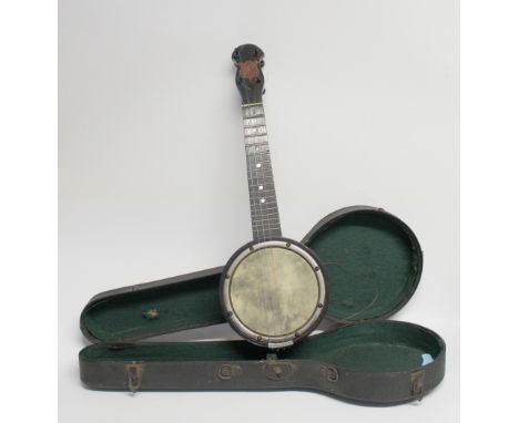 An early 20th century Vintage cased 'The Merry-Bright' four string Ukulele Banjo or Banjolele in black hard case. CONDITION R