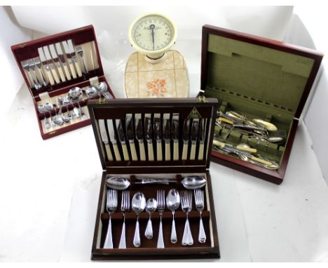 A mahogany case containing a quantity of plated and metal flatware, some matching, a cased set of Sheffield stainless steel f