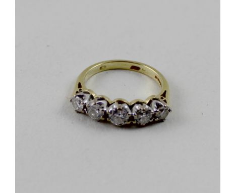 An 18ct yellow gold graduated five-stone diamond ring, central stone approx 0.30ct, stones to either side approx 0.15ct and 0