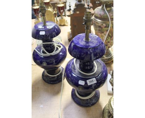 A pair of Royal Doulton cobalt blue baluster lamps to circular bases, with paper labels 'Doulton Staffs', height 49cm and a m