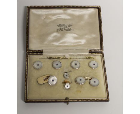 A cased set of 9ct white and yellow gold cufflinks and collar studs, each set with small sapphire, combined approx 15.7g.