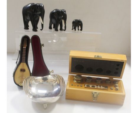 A cased set of scales, a retro stainless steel Danish bowl on three supports marked to base 'Made in Denmark', a set of three