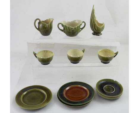 A Linthorpe Art Pottery bowl modelled in the form of a cornucopia shell, height 15cm, three green glazed trios, jug and match