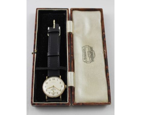 CYMA; a vintage yellow metal gentlemen's dress watch, the silvered dial set with Arabic numerals and subsidiary dial, on a la