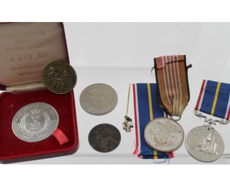 A cased 'Exclusive Edition Royal British Legion V.E. and V.J. Day Commemorative Medallion 1945-1985', a commemorative Prince 