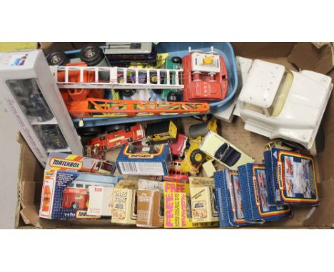 A collection of loose and boxed diecast vehicles, a vintage Ertl tinplate semi-truck and trailer, a 'Strenco' mobile crane, a
