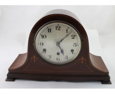 An Edwardian mahogany inlaid Napoleon hat eight-day Westminster chime mantel clock, the silvered dial set with Arabic numeral