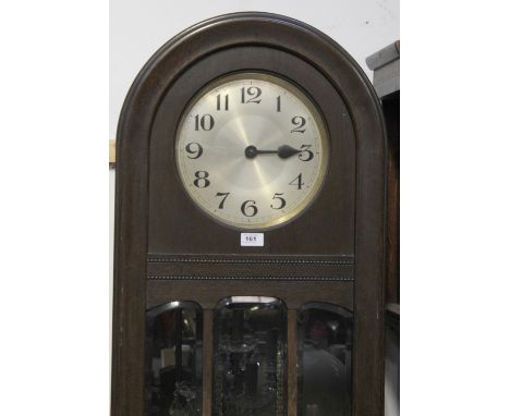 A mid-20th century oak longcase clock, domed top above gilded dial set with Arabic numerals, length 96cm.