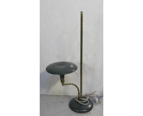 A retro brass and metal adjustable standard lamp, central brass tubular column support with outswept green metal circular sha
