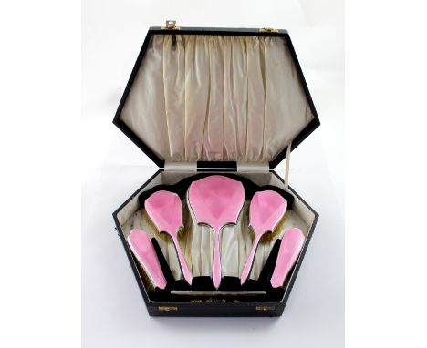 A George V hallmarked silver and pink guilloché enamel five-piece dressing table set, Daniel Manufacturing Company, Birmingha