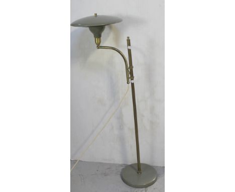 A retro brass and metal standard lamp, brass column with outswept metal circular shade to circular green metal base height ap