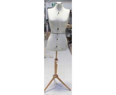 A vintage Formella 'Adjustform' female dressmaker's model on a tripartite wooden stand, height 147cm.