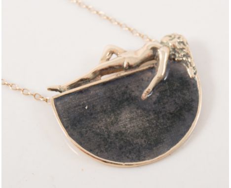 9ct hallmarked gold and enamelled pendant with reclining figure, associated trace link metal chain.