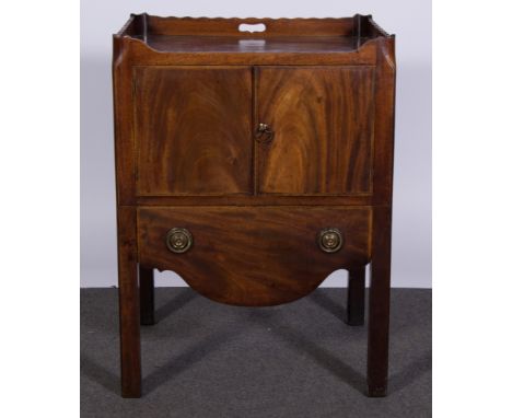 A 19th century mahogany two door night commode, with tray top and frieze drawer with a  pair of ring handles with scalloped f