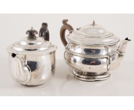 Silver teapot, by Adie Brothers, Birmingham, 1921, compressed form, wooden handle; and another silver bachelors teapot, by Th